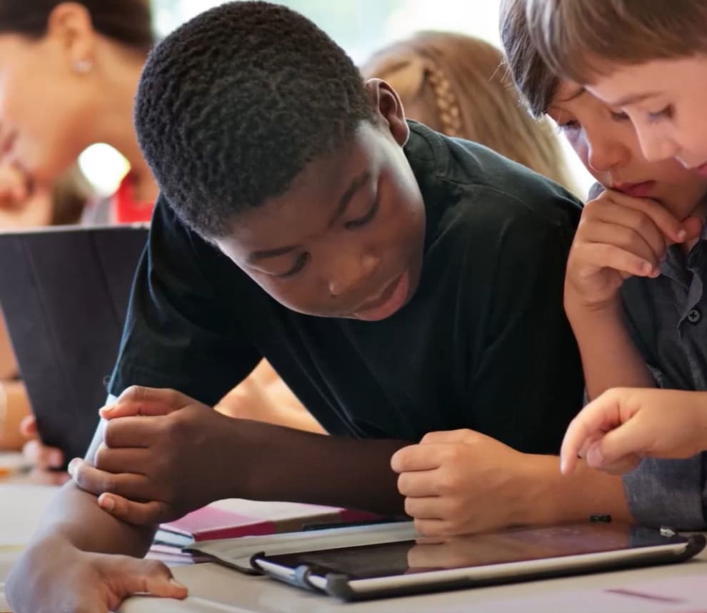 students practicing math on a digital device